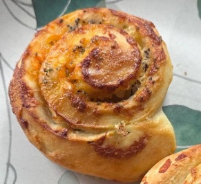 Fresh homemade Neiman Marcus Rolls filled with bacon, cheddar cheese, and chives